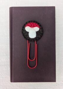 Wool felt topped jumbo paperclip bookmark with hand embroidered and appliqued mushroom motif