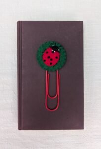 Wool felt topped jumbo paperclip bookmark with hand embroidered and appliqued ladybird motif
